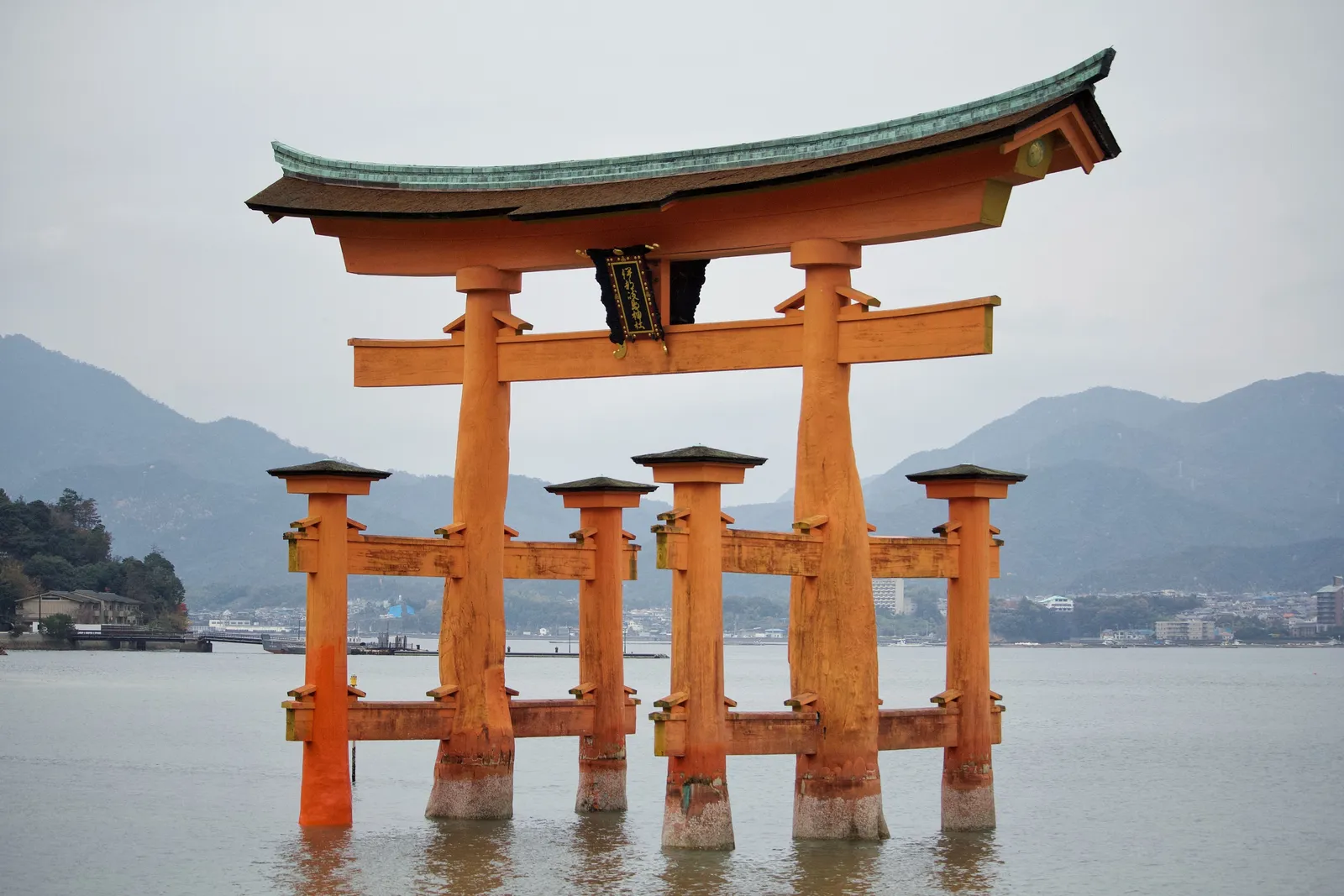 The floating torii gate of Itsukushima Shrine at Miyajima, Japan, seen at high tide in daylight