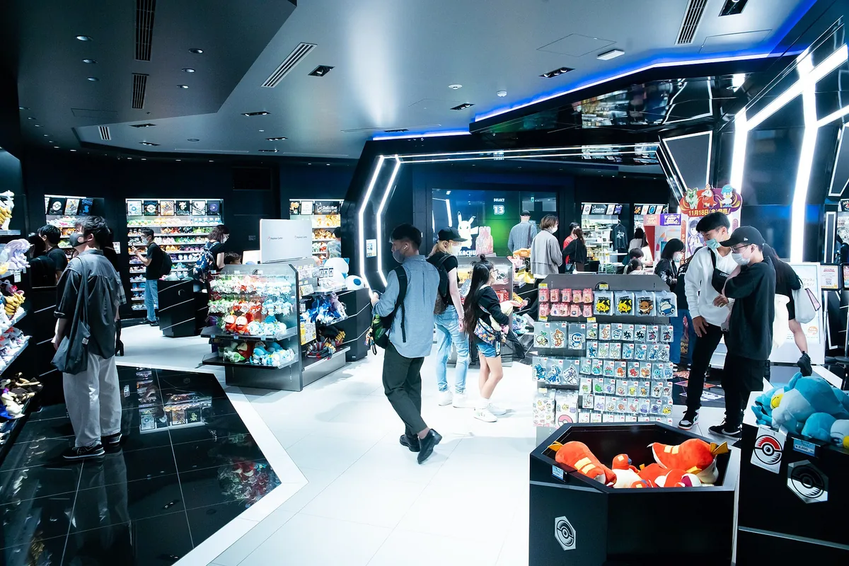 A modern black and white store hall with shelves of plush toys and colourful merchandise