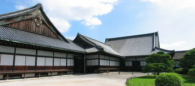 Low wooden palace buildings with wide grey tiled roofs