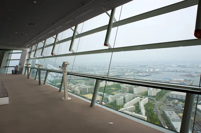 A glazed observation corridor looking down over the city and harbour