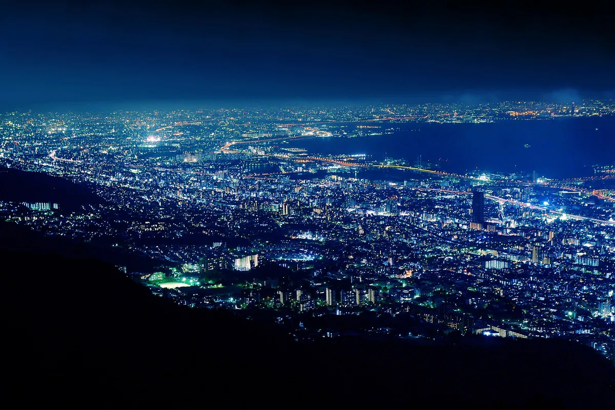 Night panorama of Kobe city lights and the bay, seen from Mount Maya