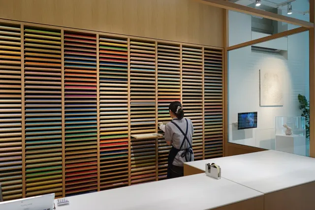 A bright, minimal store interior with slatted wooden walls