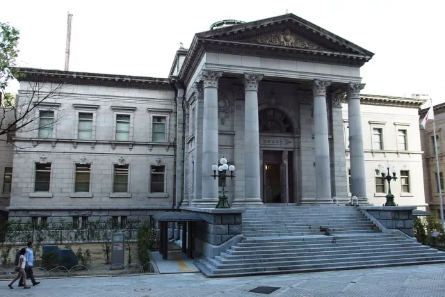 A neoclassical building with columns and wide stone steps