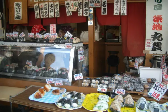 A market stall with rice balls laid out at the shop front
