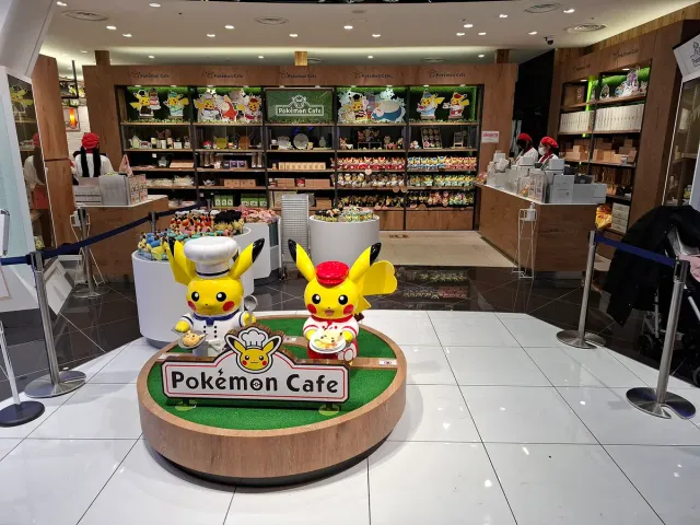 A display of Pikachu figures on a round stand in a store