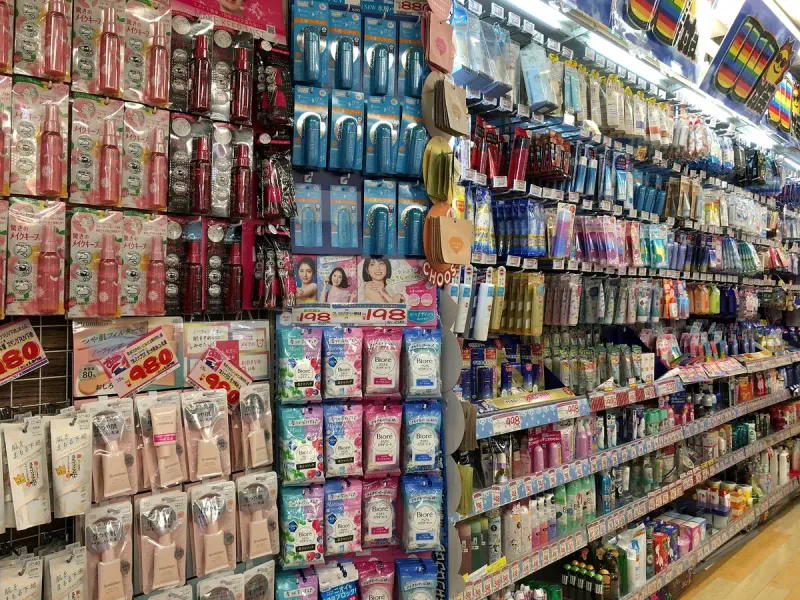 Shelves packed with cosmetics and toiletries inside a discount store