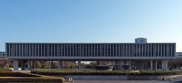 A long, low museum building raised on pillars
