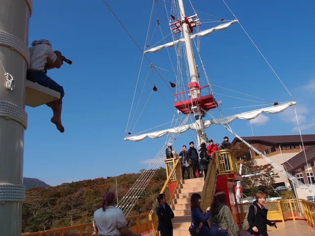 A pirate-styled cruise ship with passengers on deck